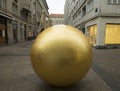 Grounded golden sun - sculpture in Zagreb, Croatia